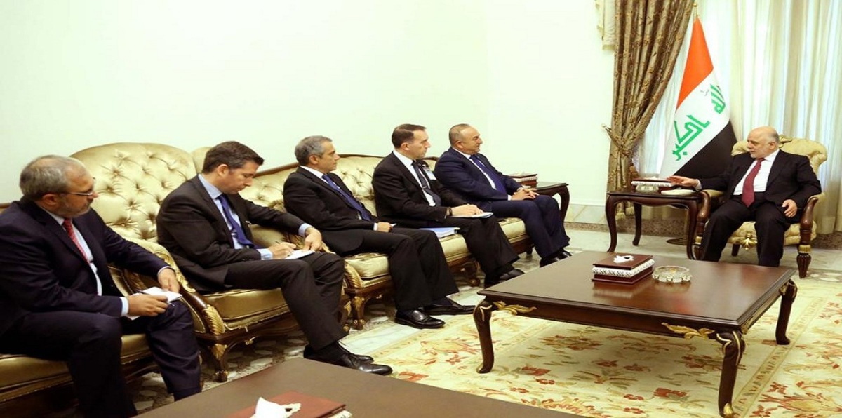 العبادي في استقبال أوغلو يطالب تركيا بإخراج قواتها من العراق