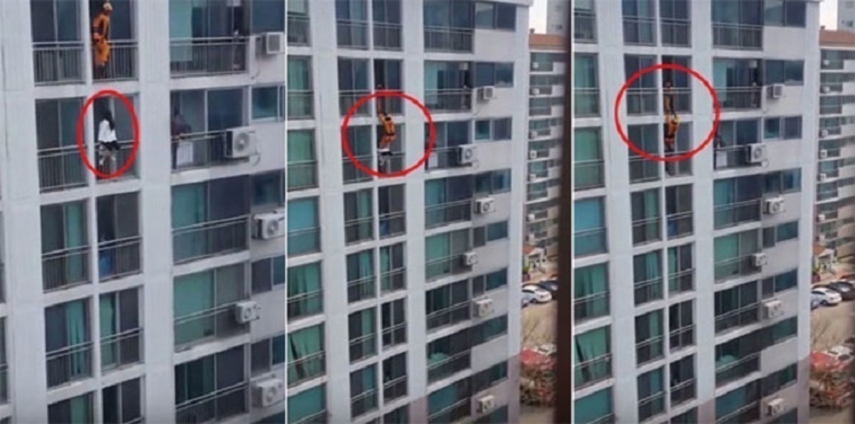 ببراعة.. رجل إطفاء ينقذ فتاة حاولت الانتحار من شرفة مبنى (فيديو)