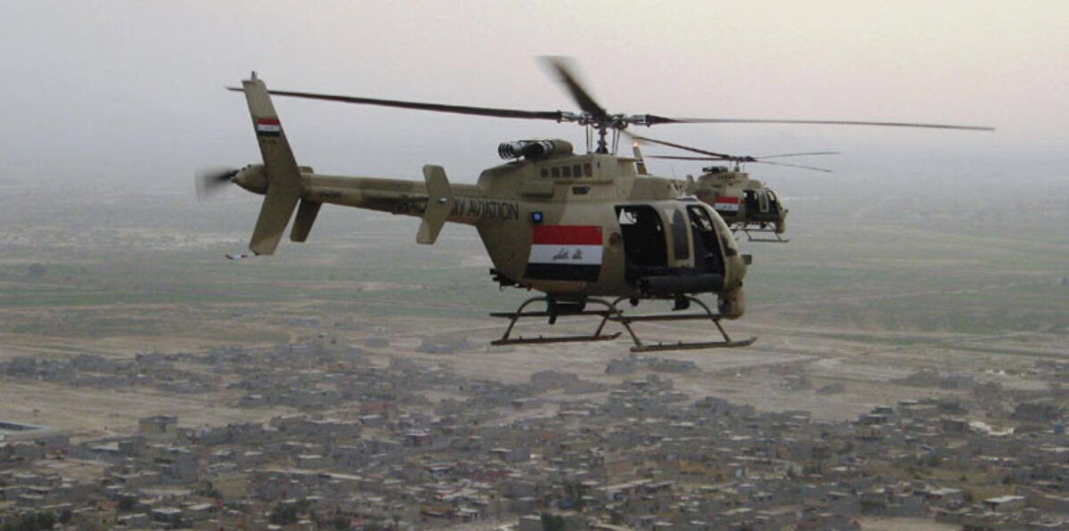 الجيش العراقي يلقي منشورات تحذيرية على غرب الموصل