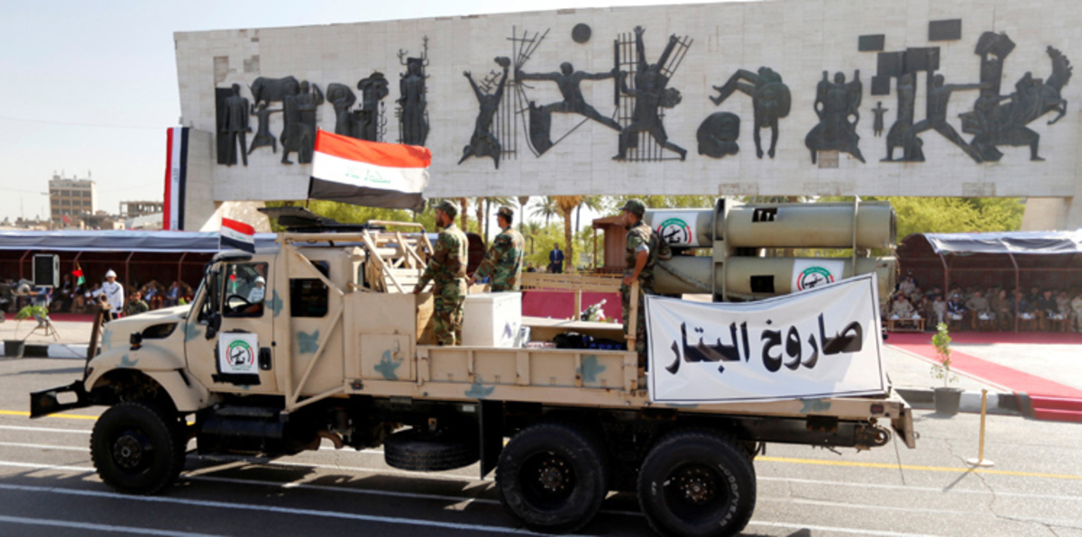 بالصور والفيديو.. استعراض عسكري للجيش والحشد وسط بغداد