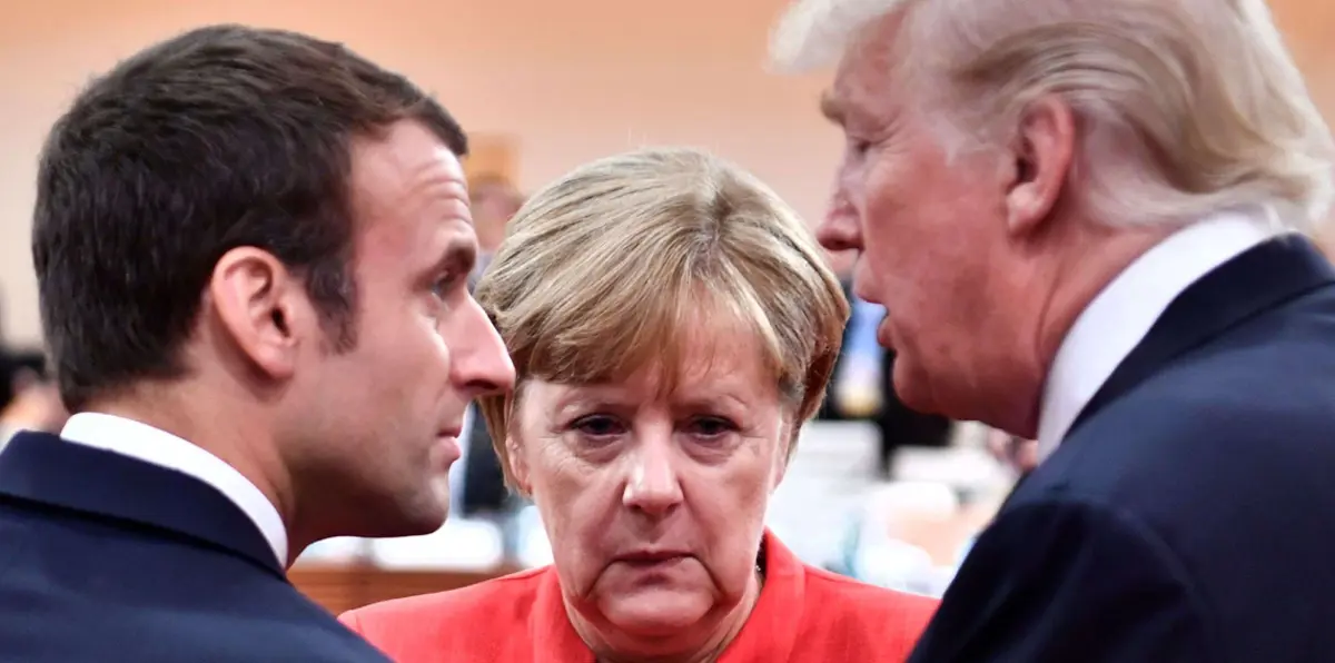 ميركل: الاتفاق النووي "ليس مثاليًا" وماكرون: علينا حماية شركاتنا