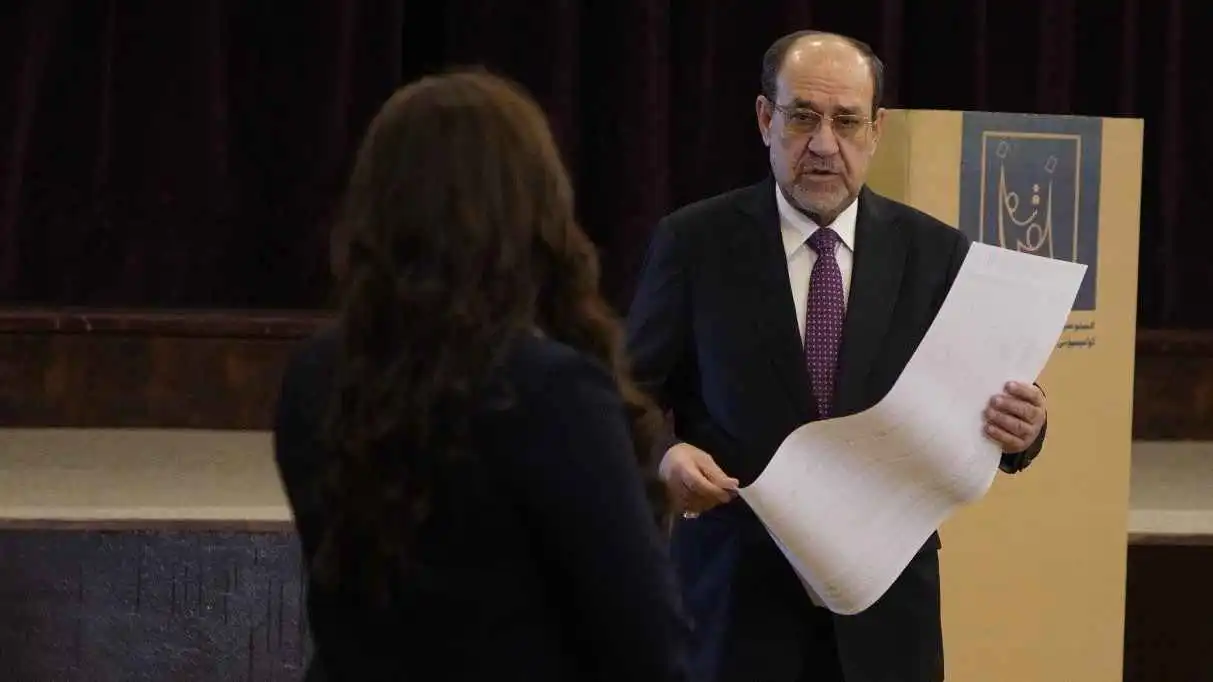 المالكي خلال الإدلاء بصوته