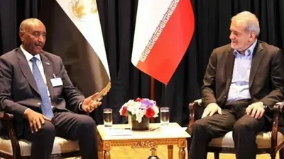 الرئيس الإيراني خلال لقاء سابق مع قائد الجيش السوداني