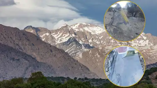 أجزاء من الحطام  وفي الخلفية جبال المحافظة الإيرانية