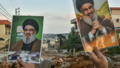 لبنانيون يرفعون صور نصر الله