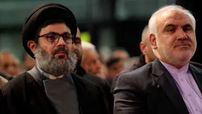 هاشم صفي الدين (يسار)