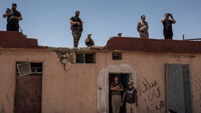 مسلحون يتبعون لإحدى الفصائل في العراق