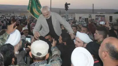 غفاري أثناء حفل لوداعه في ريف حلب