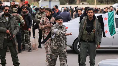 مسلحون تابعون للإدارة السورية الجديدة في درعا