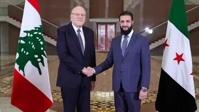 أحمد الشرع ونجيب ميقاتي