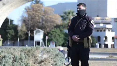 أحد أفراد الأمن السوري