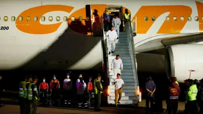 مهاجرون فنزويليون يصلون كاراكاس بعد ترحيلهم من الولايات المتحدة 