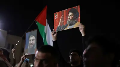 مؤيدون لحزب الله يرفعون صور نصر الله