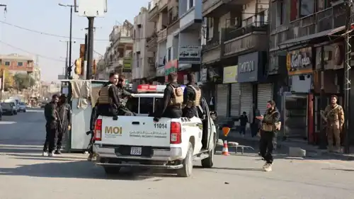 قوة أمنية سورية في موقع الجريمة