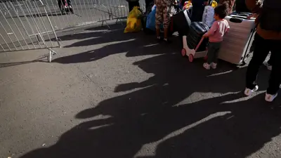 مهاجرون في مركز استقبال للاجئين في جيسن بألمانيا