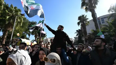 من احتفالات السوريين بإسقاط نظام الأسد