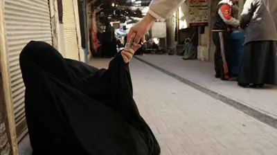 متسولة في العراق