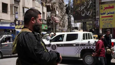 عنصر من الأمن السوري في جرمانا