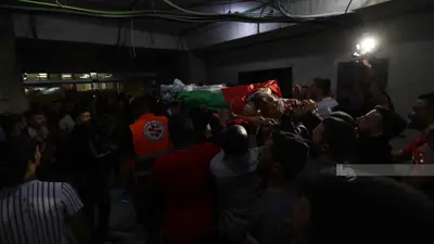 خلال التشييع في بلدة كفر مالك