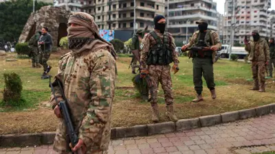 عناصر من الأمن العام السوري في محافظة اللاذقية