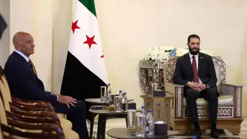 باراك وأحمد الشرع في لقاء سابق