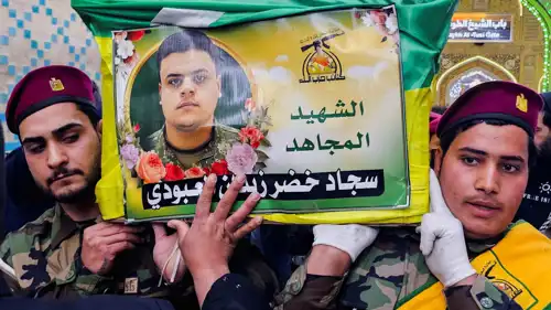 عناصر من كتائب حزب الله العراقي خلال تشييع أحد القتلى