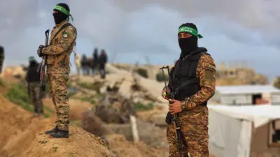 عناصر من حماس والجهاد الإسلامي في منطقة التسليم