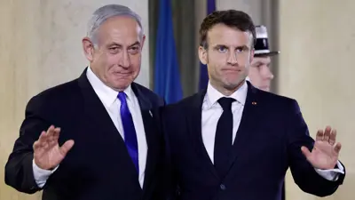 الرئيس الفرنسي خلال لقاء سابق مع نتنياهو 