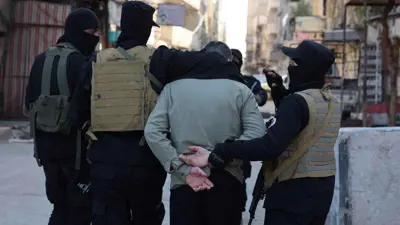 عناصر أمنية سورية خلال حملة اعتقالات
