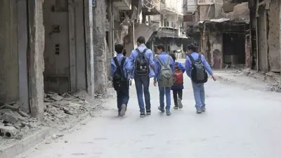 طلاب فلسطينيون في مخيم اليرموك بدمشق