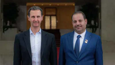 صورة تجمع مدلول العزيز بالرئيس السابق بشار الأسد