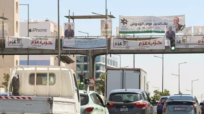 صور للمرشحين والقوائم بشوارع العاصمة عمان 